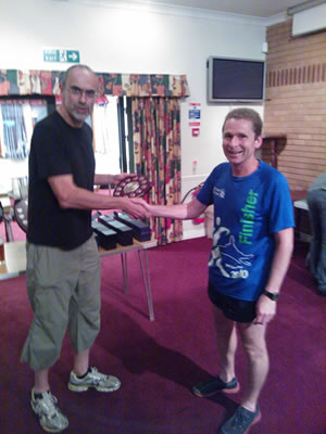 Ewen Smith receives the mixed team prize for Bourton at the Hilly 100