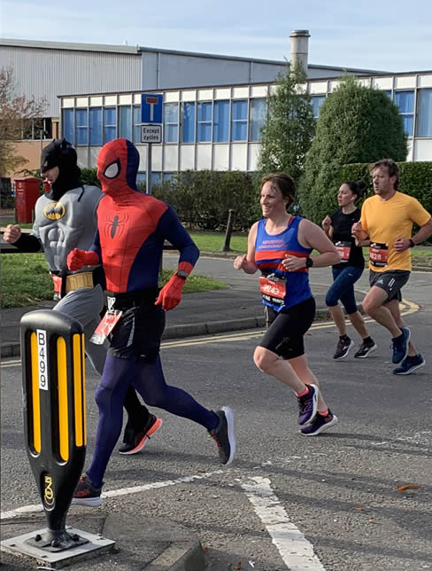 Maxine chasing-down a couple of super-heroes at the Reading Half Marathon!