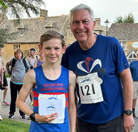 Dave Moorcroft with Thomas Harvey winner of the Bourton Junior Mile