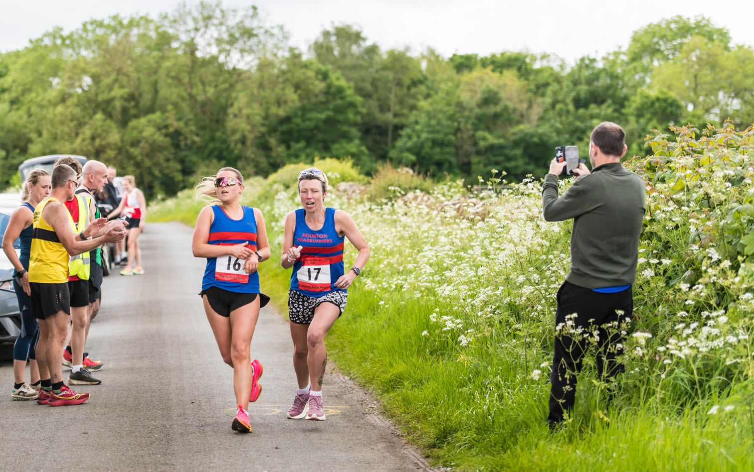 Eva hands-over to Claire at mile 60 of the Cotswold Hilly 100 Relay - 26-05-2024