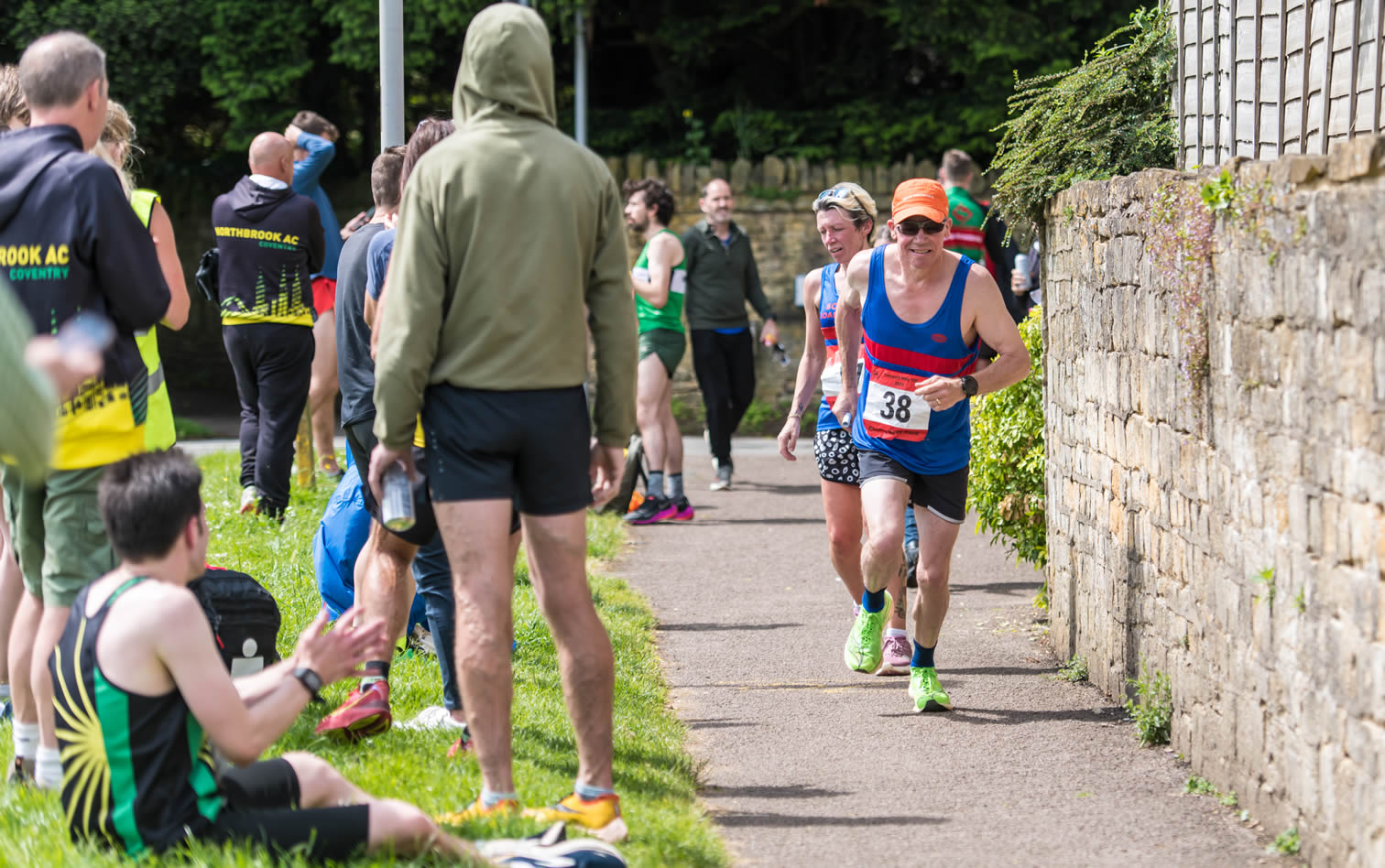 Claire hands-over to Craig at mile 70 of the Cotswold Hilly 100 Relay - 26-05-2024
